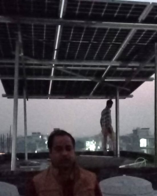 Akhil with the rooftop solar system SolarSpot installed, Hardasi Kheda, Lucknow
