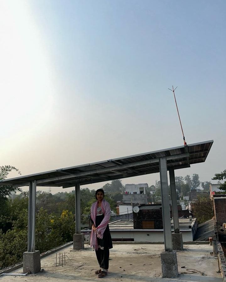 Ramendra with the rooftop solar system SolarSpot installed, Nawabganj, Barabanki