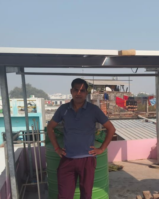 Savitri Devi with the rooftop solar system SolarSpot installed, Jankipuram, Lucknow