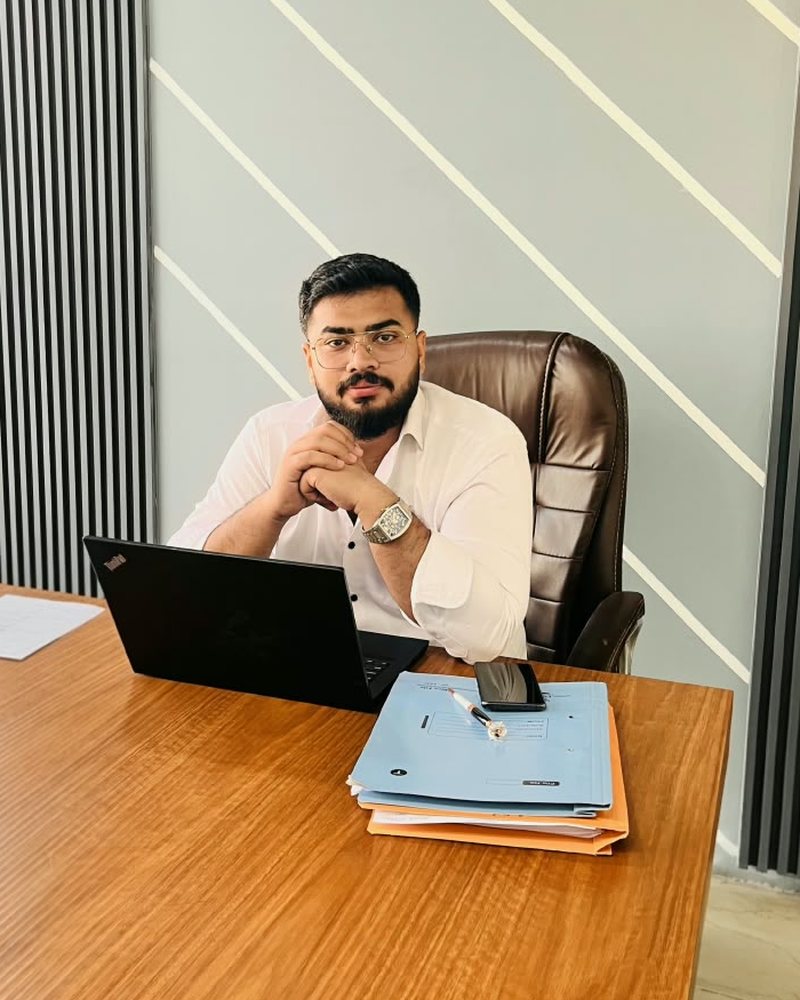 Amaan Hussain, founder of SolarSpot Innovation, at his desk