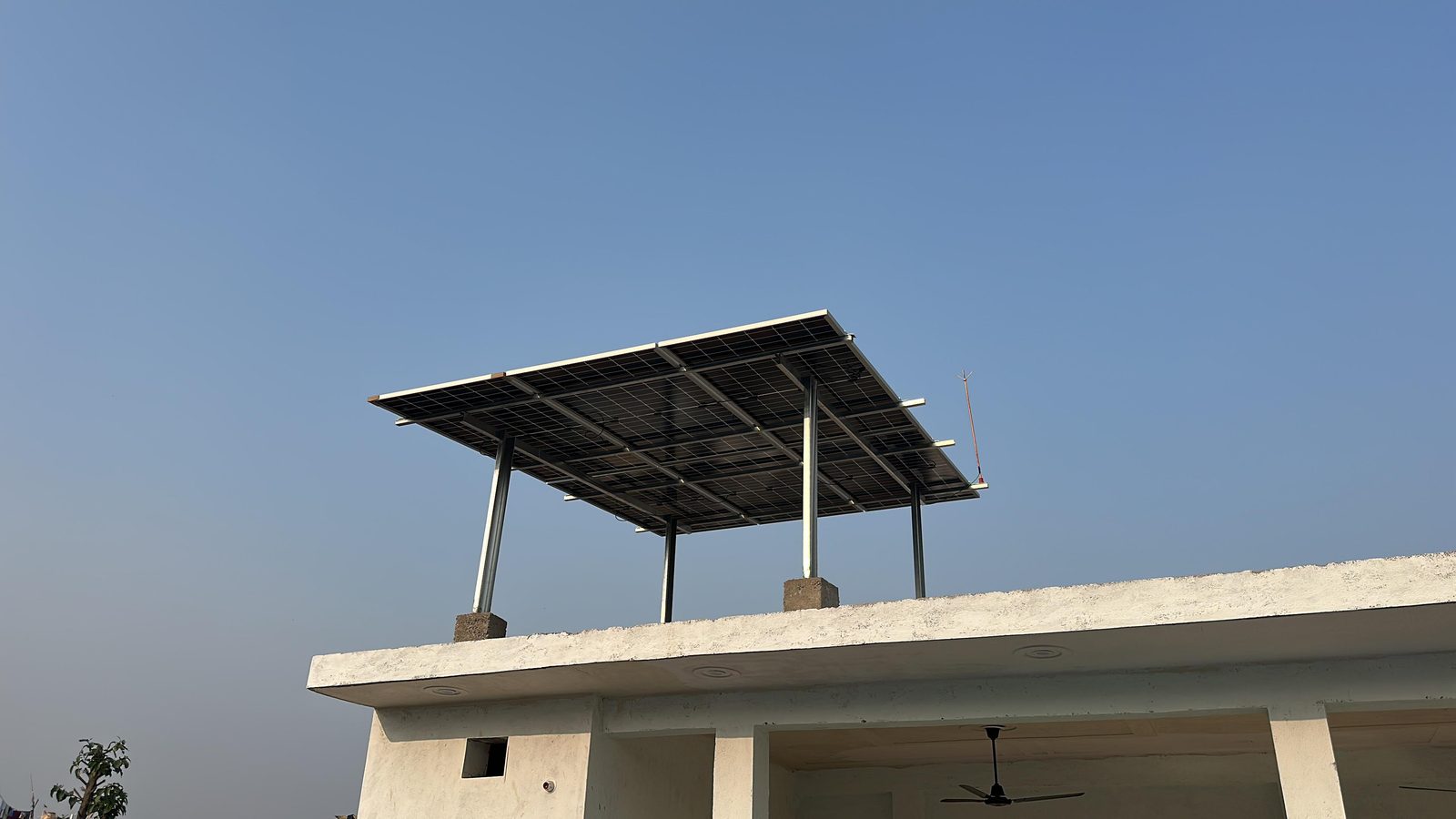 Elevated SolarSpot solar structure on a white home terrace